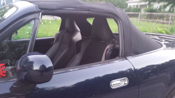 BRZ seats on stock miata rails with adapter clear the soft top.  glass rear window.