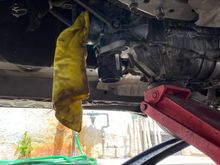 Transmission being held up by a jack 
