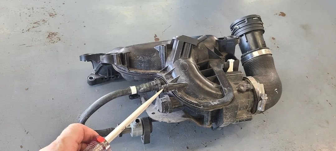 Same one as the screwdriver is pointing to