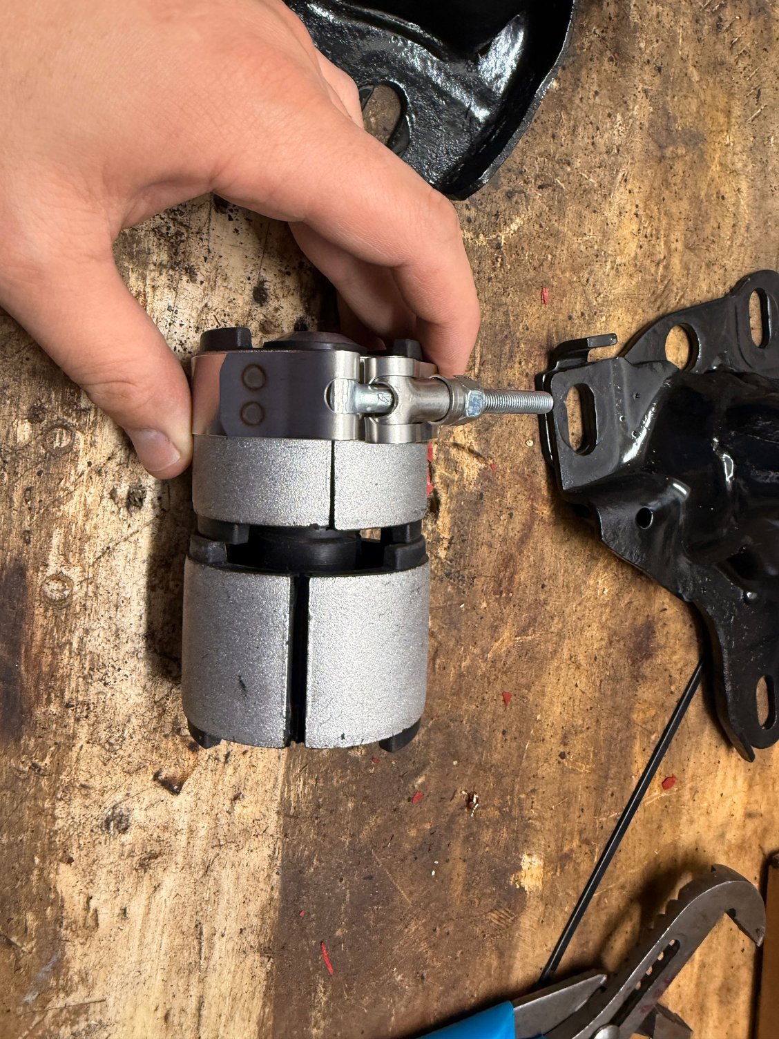 Compressed with a t bolt clamp