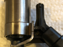 Close-up of removed injector showing rail-side sealing ring.