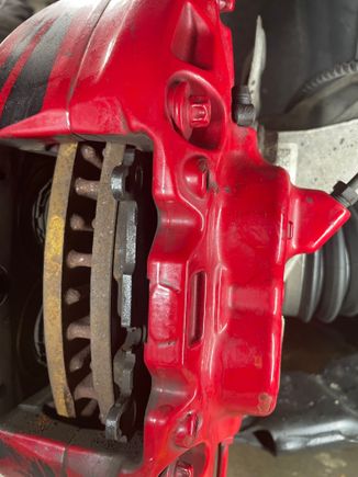 JCW caliper with a depression for compressing the pistons