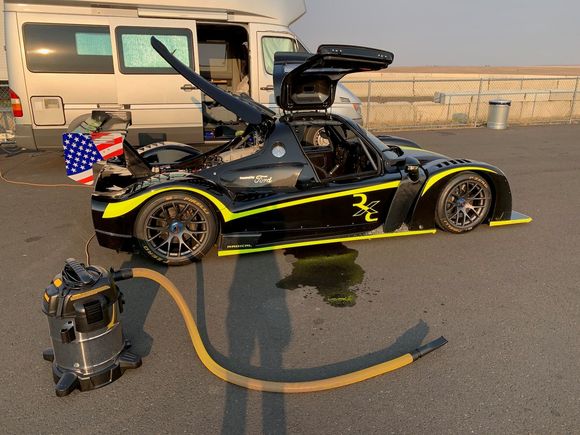 I brought the shop vacuum specifically to blow out over 5 lbs of gravel the car tires picked up and deposit onto the aero body panels; the gravels were picked up between the garage and the paddock by the slicks