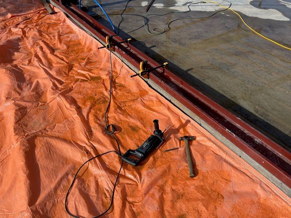 We covered the aprons with insulating blankets so they don't freeze overnight. Here I installing the base channels for the siding to be fastened to.