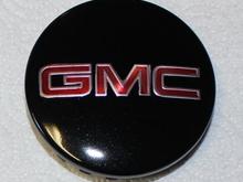 Painted Sierra center cap. Was originally the brushed aluminum. I taped &amp; painted the lettering &amp; black cap.