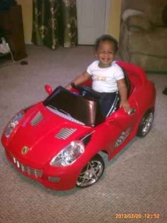 My little guy with his 1st Birthday present.