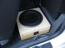 Custom box that fits under the rear jump seat.