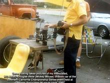 Gene Husting, Owner of Associated RC Cars takes photo of Tom Douglas's Associated RC 300 Wide Chassis car, better known as the Mickey Mouse chassis.