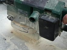 Sanding into shape with a belt sander