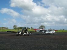 A1 S"Sandy" with a friends OV1 Bronco. We flew many times in formation of our clubs field in Toa Baja, Puerto Rico