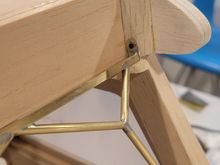 The top has two fasteners that attach the support to the balsa frame.