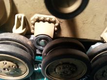 How do you remove the round fastener (to remove the suspension arm)?
