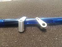 CNC arms are made of Aircraft grade aluminum so you can drill and/or tap the holes for a ball joint of regular nylon clevis.