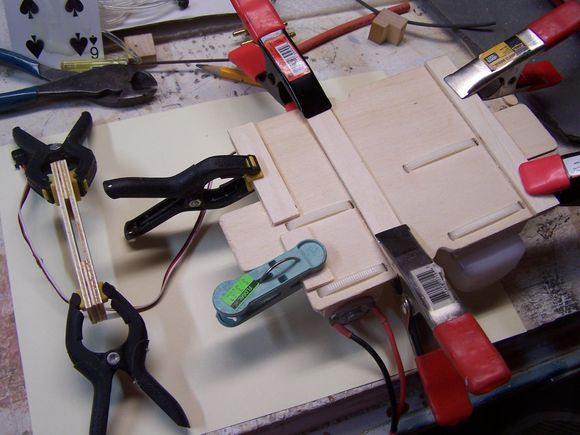 some standoffs on the bottom of the hydraulic pump tray for the zip ties and nose steering extension to clear