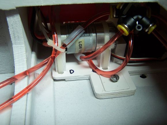 The lines that touch the pump got a silicone sleeve to insulate them. Im not sure how hot the pump motor will get