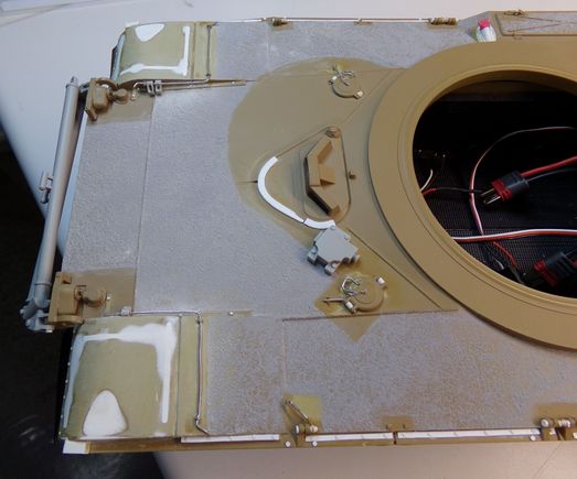 Shows the front mudflaps filled in since the A2 uses this type.  Hand hold replaced with wire.  Filler cap was re-oriented to an angle, handle replaced, retaining chain added, and details re-worked.  Mineplow connection box added.  Track hanger pins simulated.  Lip detail added to the driver's hatch.  Fender springs re-worked with metal rod and added track endlinks.