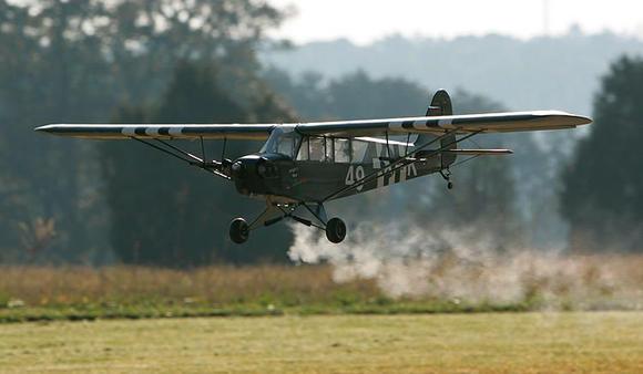 early morning flight and exhaust vapor in the cool air