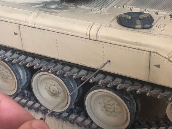 I use a small wire tool slid through the hole to push the on/off button. 