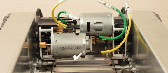 Remove all the Tamiya gearbox stanchions. The gearboxes sit flush to the gearbox mount brace,