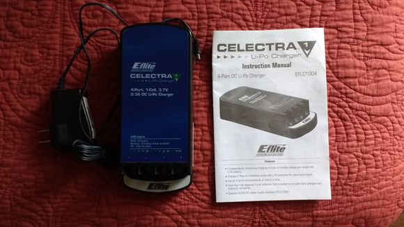 4 x 1 cell charger w/ AC adapter