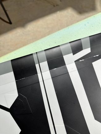 Paint chipping the on stiff leading edge flap due to being too stiff. 