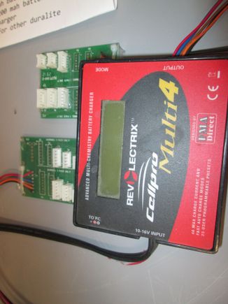 Charges the EXB batteries using the white and black plugs, needa any 12V source