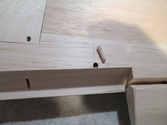 The end result is a cleaner hole.  Note the balsa plug...