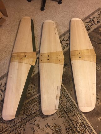 Two new scale wings after fiberglassing the center section (right and middle).  On the left, is a wing "Frankensteined"/cannibalized from two older hand-cut prototype wings that were previously crashed.  On one wing, the right panel survived; and, on the other wing, the left panel survived. My original prototype wings were stretched-out four inches from true scale.