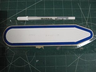 White pen used to place index marks for overlay panel centering -