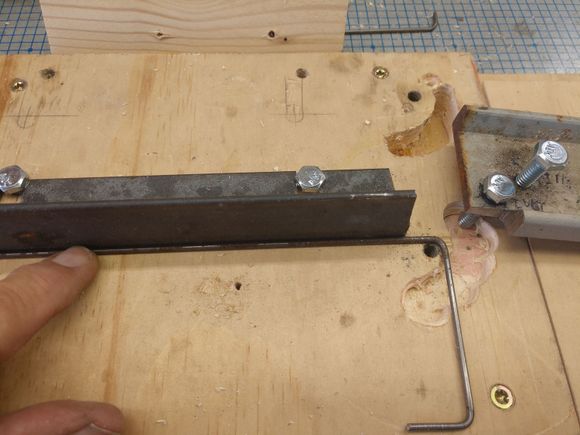 You can see the slot for the bending bolt. the bolt needs to go below the base to get flat bends. With sturdier construction so the was no play in the handle the slot might not be needed
The hole at the top bend is tapped for a 1/4 20 bolt, This is the pivot.