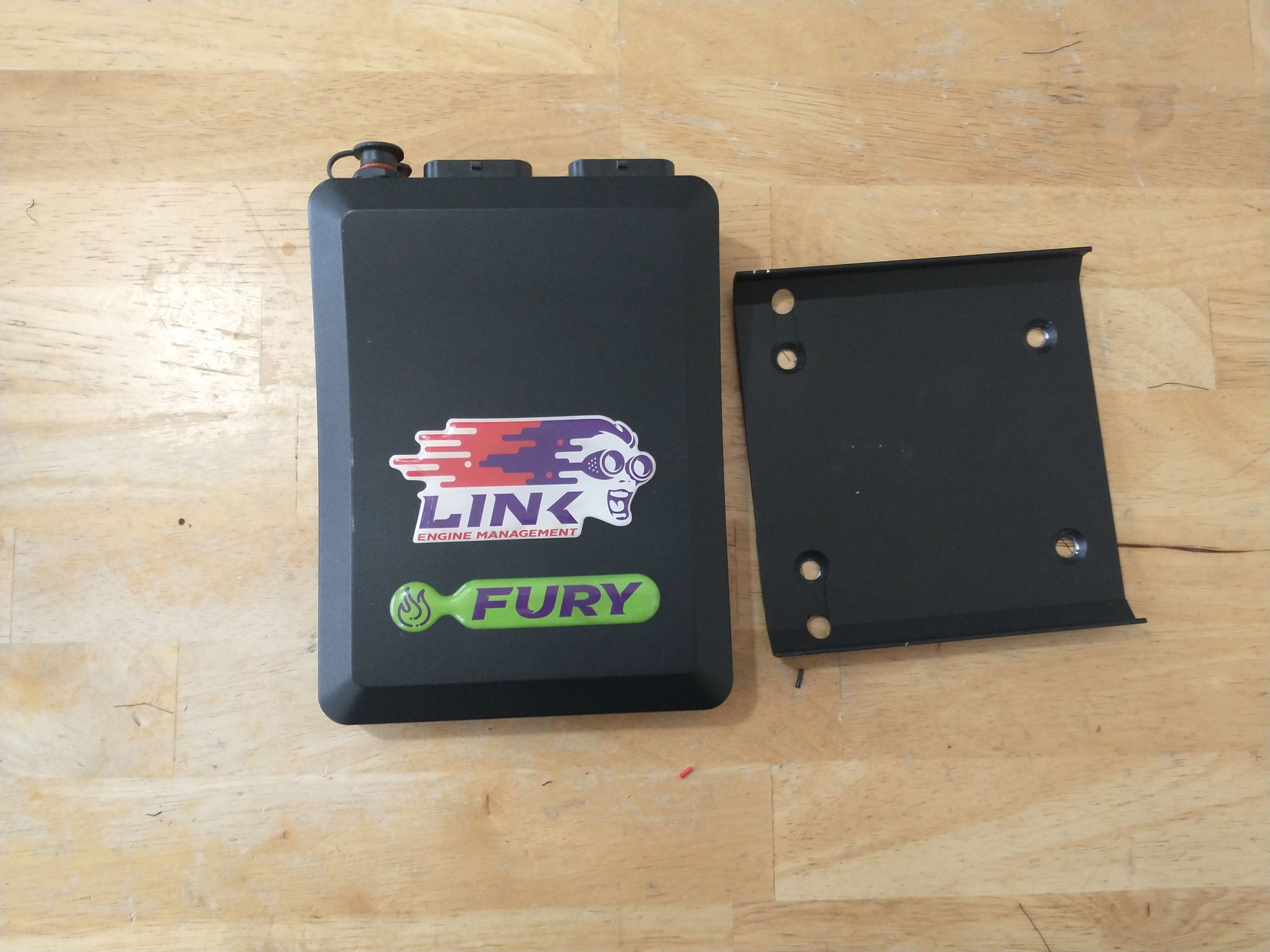 Photo of the ECU + mounting bracket