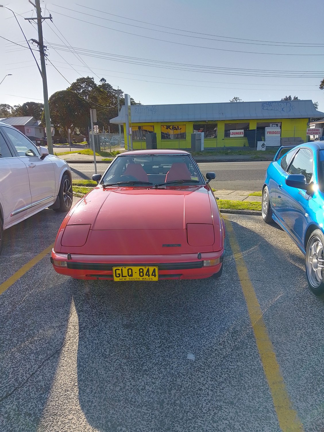 Car waiting for wheel alignment and tyres.