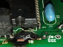 Note the broken solder runs between Q1 and ZD3.