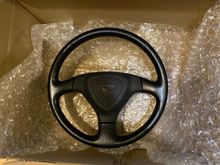 My efini wheel is getting recovered with Alcantara and black perforated leather with red stitching 