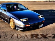 Mazda RX 7 wid racing heart wheels painted gold