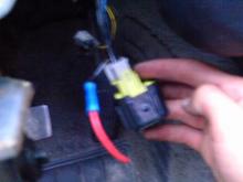 That red wire was spliced into the ignition ran to this wire, that is connect to the black box.