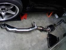 SMB resonated downpipe.  Metallic cat with muffler in midpipe.