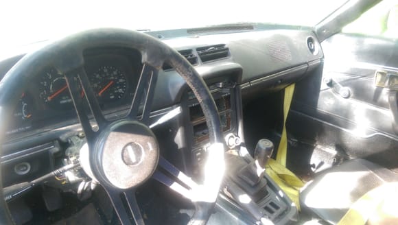 The interior is in surprisingly nice shape for the condition of the underside of the car.