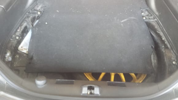 This car was equipped with the Bose system, which is why there's the gaps in the trunk area carpet.