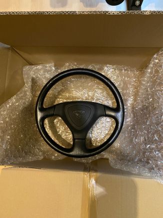 My efini wheel is getting recovered with Alcantara and black perforated leather with red stitching 