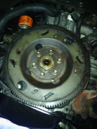 Flywheel and flexplate visible with torque converter removed...that nut is going to be a pain in the ass, I can already tell.