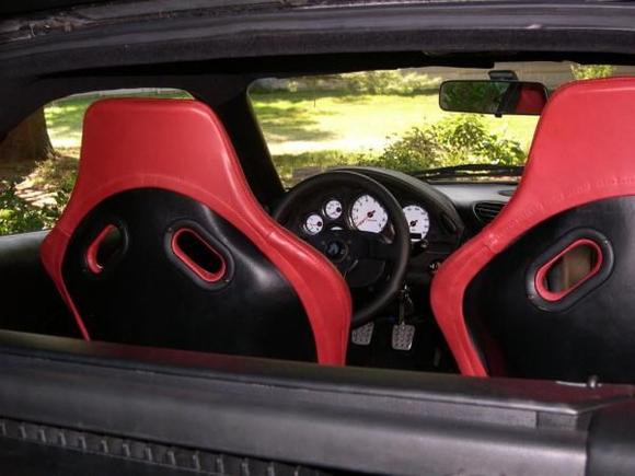 Closeup shows the way I covered the backs of the Spirit R seat carbon fiber with black leather and replicated the way the stock Spirit R seat covers are wrapped around the frame only in red fatted calf leather instead of stretch cloth (Picture121)