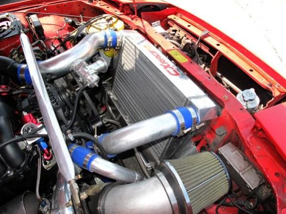 engine bay on the 7 with the big front mount intercooler provided by CXRacing.