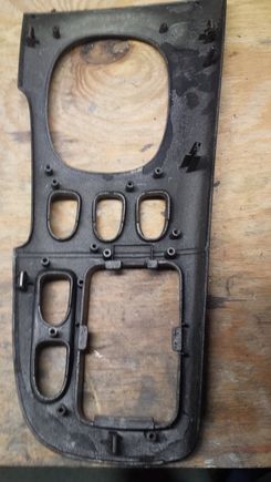 Underside view. All the mounting tabs/pins are intact, but one of the metal clips that goes on a tab is missing.