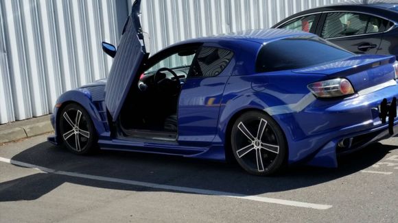 Lambo doors and a bumper held on with duct tape