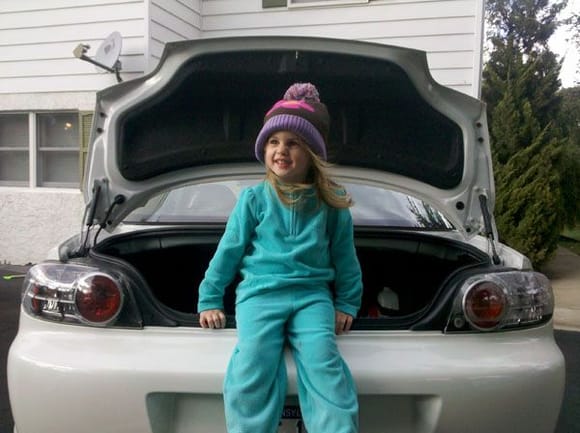 My daughter relaxing a bit on the rear bumper of the 8. :)