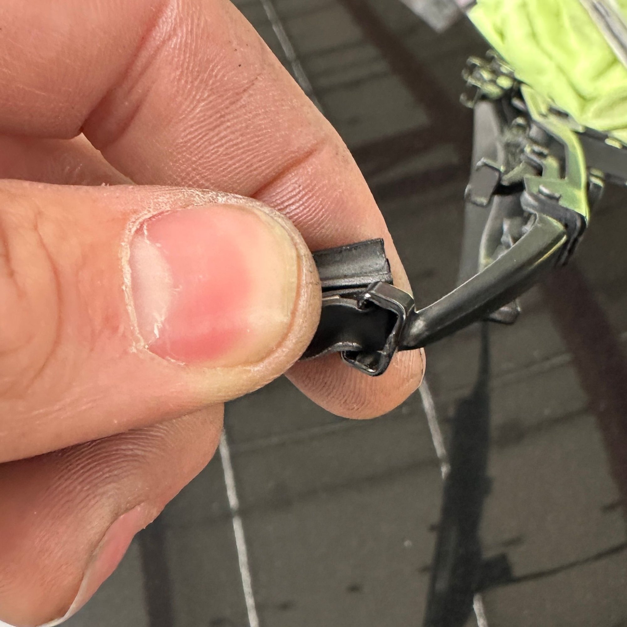 Fold it down like so and pull, and it should come free.