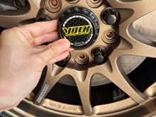 Now the decision is which center cap to go with. Both are from AliExpress. The black matches the lug nuts...