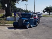 Cars are lined up for about a half mile to get in. 