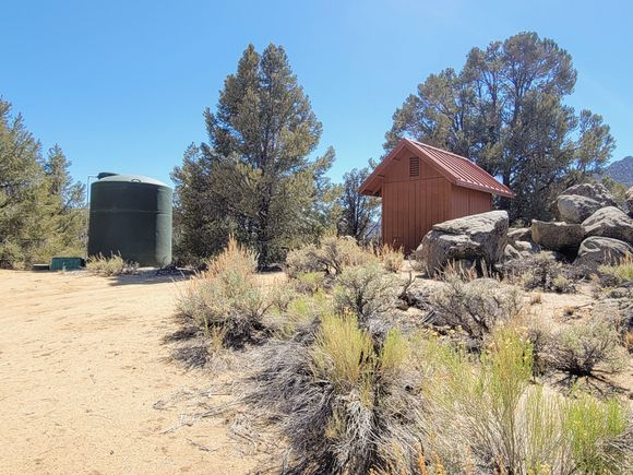 ^6-11-2021.  Water storage tank and generator shed.  